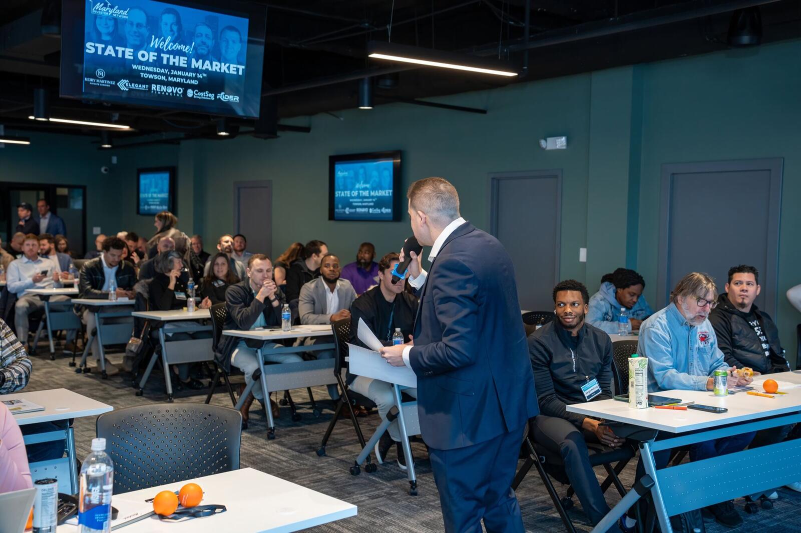 Speaker presenting at a State of the Market seminar